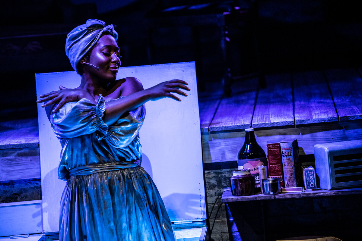 Tyler Symone performing in Caroline, or Change